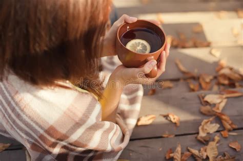 Warm Cup Of Hot Coffee Warming In The Hands Of A Girl Autumn Outdoors