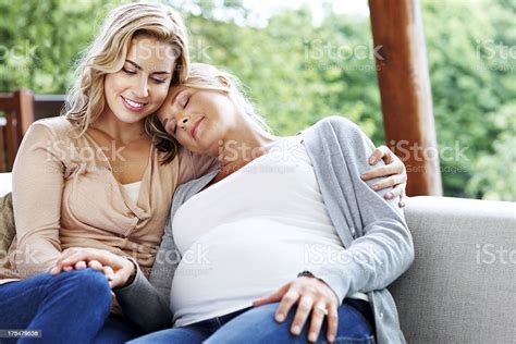 Pregnant Lesbian Couple Sitting Together Stock Photo More Pictures Of