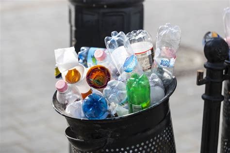 Street Trash Cans Are Filled With Garbage Cans With Plastic Bottles Of