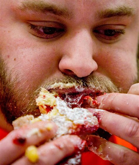 Competitors Pound Down Paczki At Flint Area Fat Tuesday Eating Contests