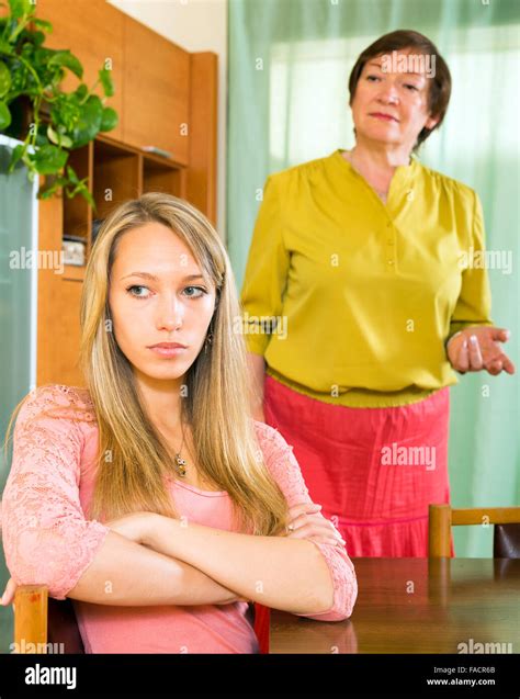 sad adult daughter at table against mature mother after conflict stock my xxx hot girl