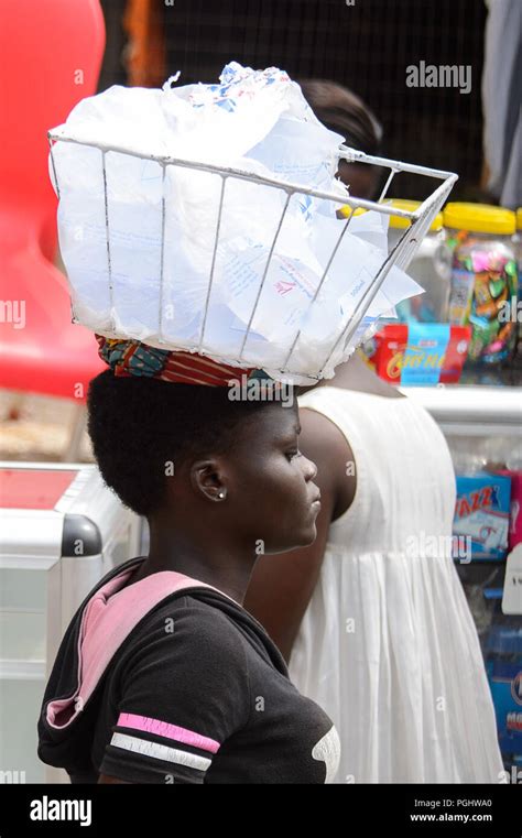 kumasi ghana jan 16 2017 unidentified ghanaian woman carries a basket with water on het