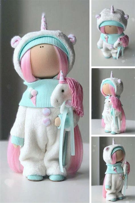 The Doll Is Wearing A Unicorn Outfit And Holding A Small Toy Horse In