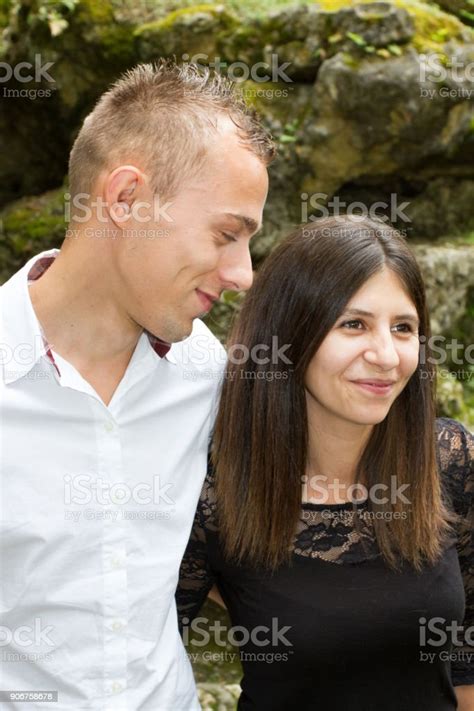 Side View Of Handsome Husband Kissing His Brunette Wife Romantic