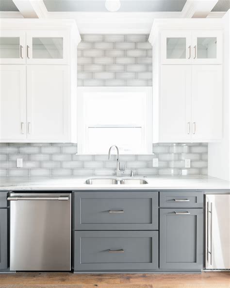 Two Tone White And Dark Gray Shaker Cabinets With Gray Subway Tile