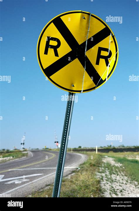 Circular Railroad Crossing Road Sign With Railway Tracks In The