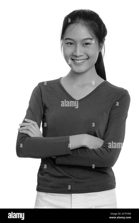 Portrait Of Happy Young Beautiful Asian Teenage Girl Smiling With Arms
