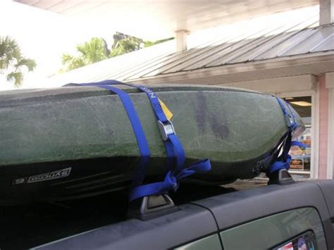 As you're passing the straps through your vehicle, remember to twist them to prevent them from making a high pitched howling sound when you are driving. How to Strap a Canoe or Kayak to a Roof Rack