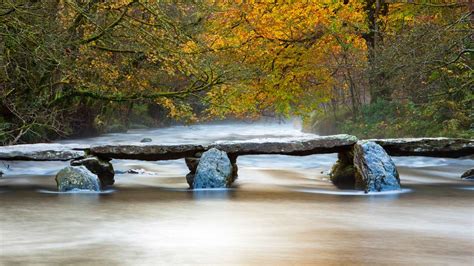 The Tarr Steps Across The River Barle In Exmoor National Park Somerset