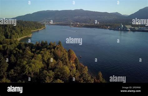 Lions Gate Bridge Over Burrard Inlet With Sailing Boats From Stanley