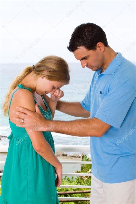 Young Man Comforting Crying Woman — Stock Photo © Michaeljung 12442537