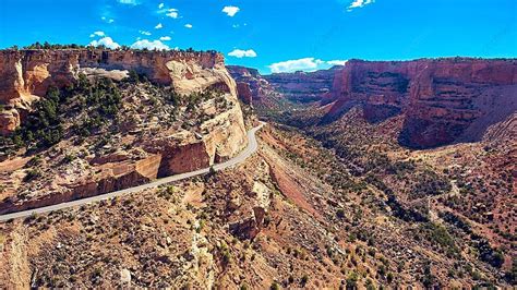 Scenic Drive Along Vast Canyon Cliffs And Valley In The Midst Of A