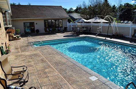 Creating The Look Of Stones With Concrete On A Residential Pool Deck