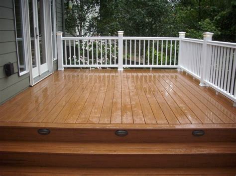 Timbertech is 100% smarter than wood™. Timbertech teak deck with white Radiancerail | Deck ...