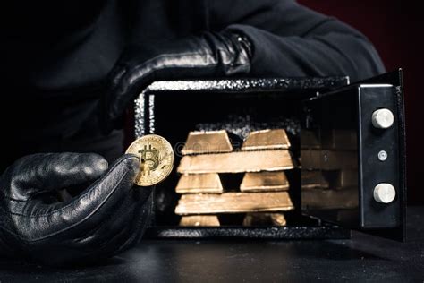 cropped view of thief stealing gold bullions and bitcoin editorial photo image of background