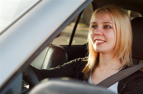 Young Teenage Girl Driving A Car Ticket School