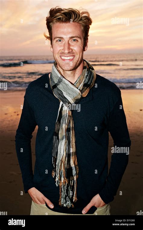 Smiling Caucasian Man Standing On Beach Stock Photo Alamy