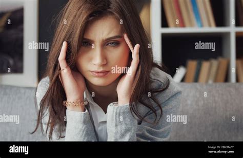 Depressed Woman Touching Temples Headshot Stock Photo Alamy