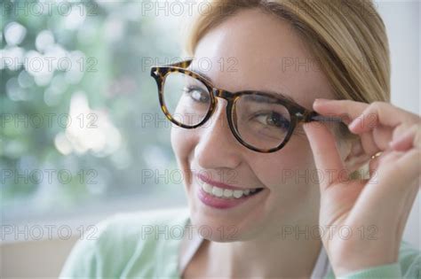 smiling caucasian woman wearing eyeglasses photo12 tetra images jgi jamie grill