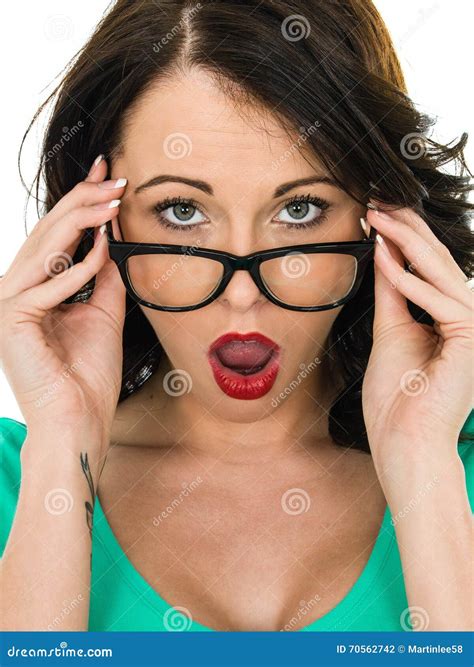 Shocked Young Woman Looking Over Her Glasses With Her Mouth Open Stock