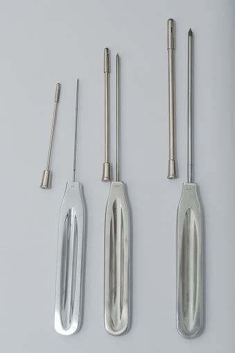 Different Types Of Catheter Trocars On White Surface Stock Photo