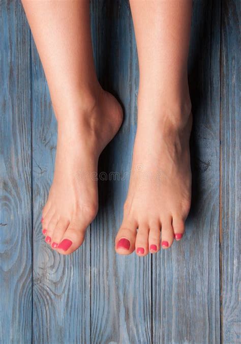 Well Groomed Female Feet On Wooden Floor Stock Image Image Of