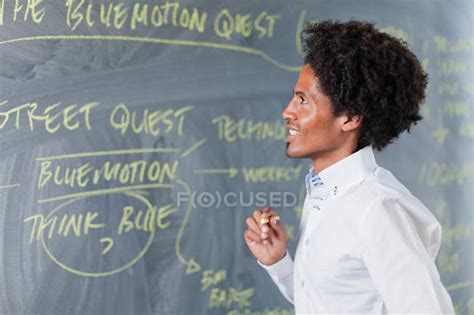 Teacher Writing On Chalkboard — Blackboard Thought Stock Photo