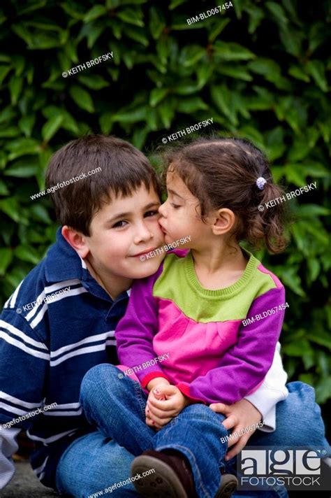 Sister Kissing Brother Stock Photo Picture And Royalty Free Image