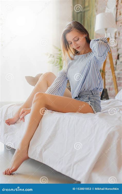Young Cute Girl Sitting On Bed Beauty Comfort And Relaxation Stock Image Image Of Cute Girl