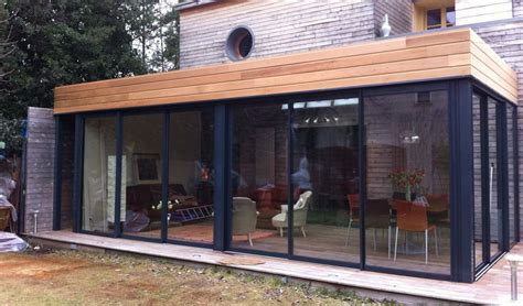 Pour une extension modulaire, le m² commence autour de 1700 euros / m² Extension Veranda Bois Toit Plat - Veranda et abri jardin