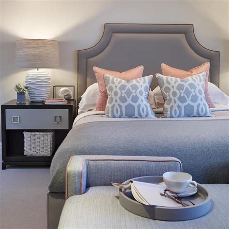 The upholstered sleigh bed is wonderfully opulent, and works perfectly with the gray, distressed cement effect back wall. Gray and Pink Bedroom with Two Tone Nightstand - Contemporary - Bedroom