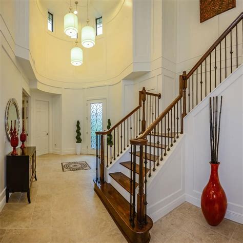 Two Story Entryway Is Open Eclectic Tuscan Decorating Foyer