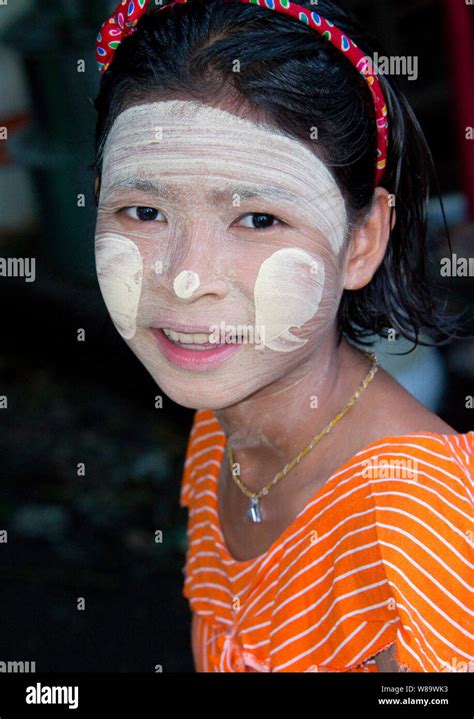 A Young Burmese Girl With The Traditional Thanaka Makeup On Which Is A