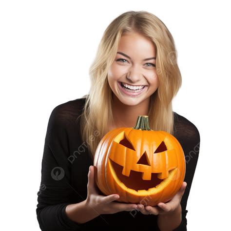 pretty blonde girl smiling with halloween jack o lantern pumpkin isolated over grey pumpkin