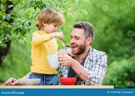 father and son eating outdoor we like spending time together vegetarian diet healthy food and