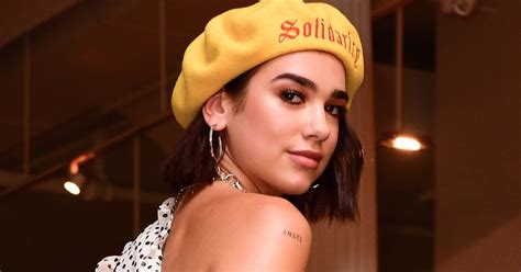 Leggy dua took her new inking to the stage when she headed to the paris stage in her long hot pink boots and mini dress. Dua Lipa Explains The Meaning Behind Sunny Hill Tattoo