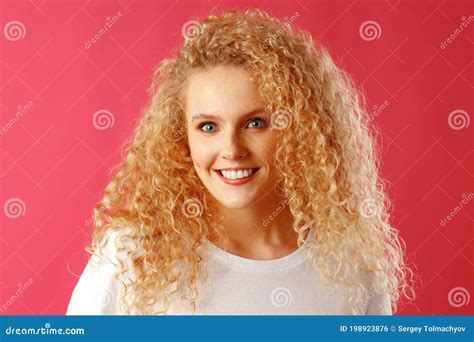 Gorgeous Beautiful Young Woman With Curly Hair Posing At Camera Stock