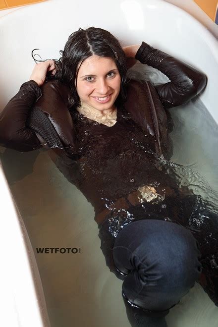 Fully Clothed Woman In Jacket Tight Jeans And Boots Get Soaking Wet In Bath Wetfoto Com