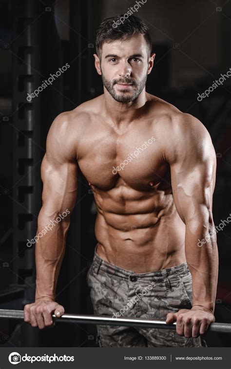 Strong And Handsome Athletic Young Man Muscles Abs And Bicep Fitness