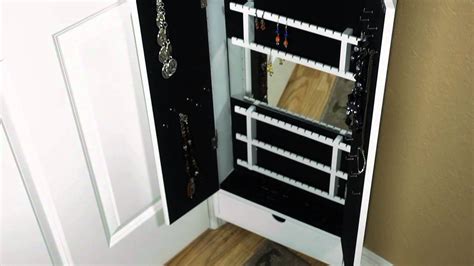Easy to install by simply attaching to your cabinet door or to a wall, this rack has 3 adjustable shelves to accommodate a variety of container sizes and is durably made with metal wire construction. Cabidor Jewelry Storage Cabinet | Behind The Door storage ...