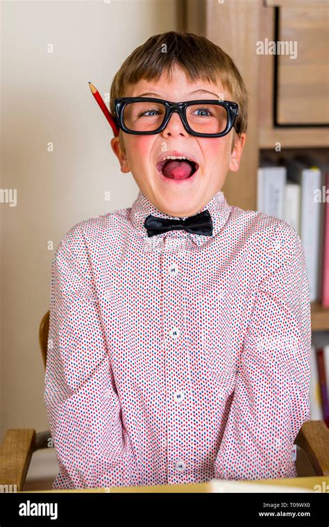 Little Nerdy Boy With Geeky Goggles Making Facial Expressions Stock