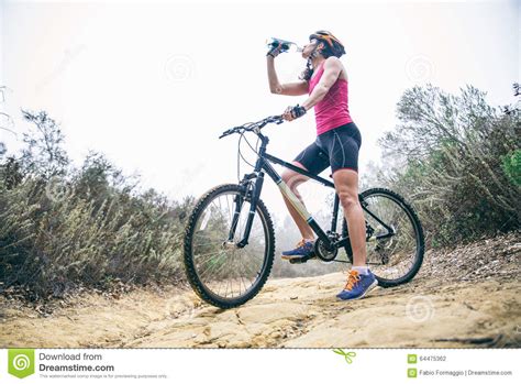 Woman Drinking Water On A Bicycle Stock Photo Image Of