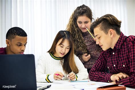 Download Premium Image Of Group Of Diverse Students Studying Together