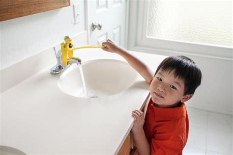 The Aqueduck Faucet Handle Extender Helps Kids Reach The Faucet