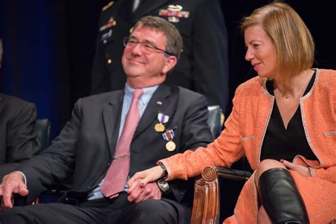 deputy defense secretary ash carter and his wife stephanie hold hands as they listen to a