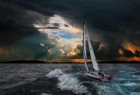 A Sailboat In The Stormy Seablack Background Stock Photo Image