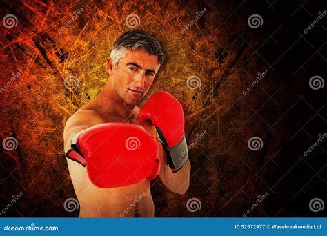 Composite Image Of Fit Man Punching With Boxing Gloves Stock Image