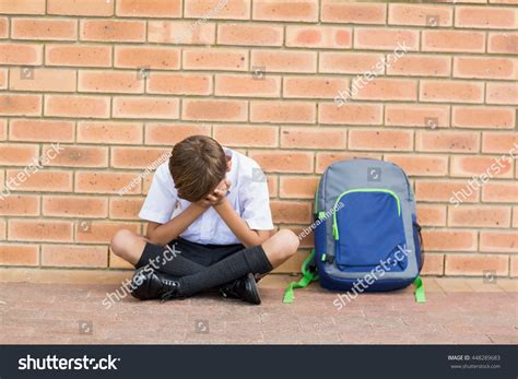 Sad Schoolboy Sitting Alone Corridor School Stock Photo Edit Now