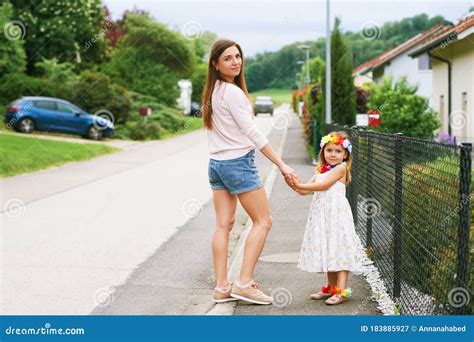 Mother And Daughter Walking Together Outside Stock Image Image Of