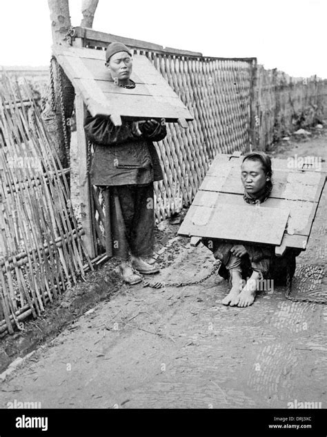 Two Prisoners Wearing The Cangue China Stock Photo Alamy